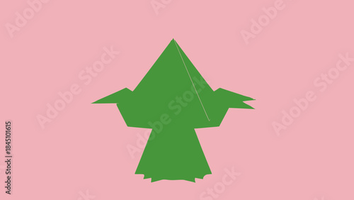 A green origami bird in flight against a soft pink background with a minimalist creative design element