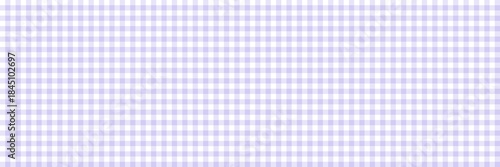 A soft pastel purple and white gingham pattern. Seamless light lilac plaid background for textile, fabric, tablecloth, or vintage scrapbook paper design.