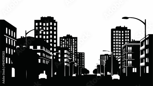 Silhouette of a Cityscape with Tall Buildings and Streetlights.