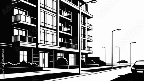 Modern Apartment Building Facade with Balconies and Streetlights.