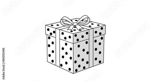 Seasonal gift box is covered in playful polka dots with a delicate bow on top and evokes celebration joy and a sense of surprise for the recipient.