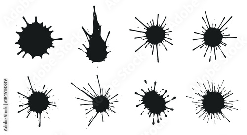 Collection of black paint splatters arranged in two rows on a white background creating an abstract ink blot pattern study.
