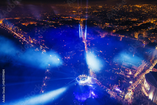 Fototapeta Naklejka Na Ścianę i Meble -  New Year’s Eve Gathering Around Thessaloniki White Tower with Festive Lights and Urban Energy