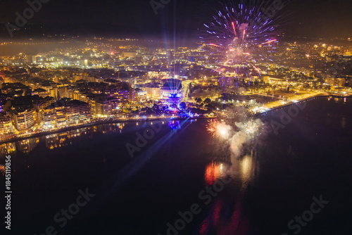 Fototapeta Naklejka Na Ścianę i Meble -  New Year’s Eve Celebration with Fireworks Over Thessaloniki’s Waterfront and Historic Tower