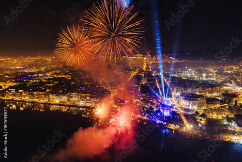 Fototapeta Naklejka Na Ścianę i Meble -  New Year’s Eve Celebration with Fireworks Over Thessaloniki’s Waterfront and Historic Tower
