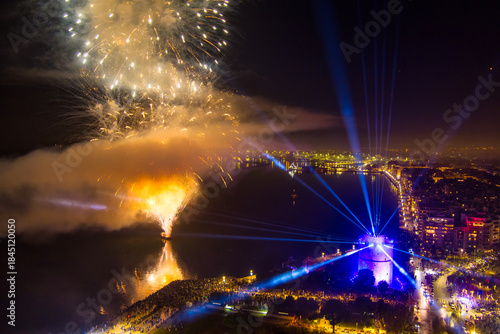 Fototapeta Naklejka Na Ścianę i Meble -  New Year’s Eve Celebration with Fireworks Over Thessaloniki’s Waterfront and Historic Tower