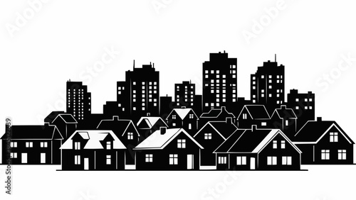 Silhouette of houses and city buildings at dusk.