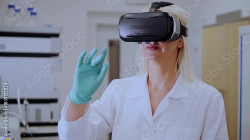 Professional scientist using VR headset in chemistry lab for interactive molecular modeling, representing future of research and immersive technology.
