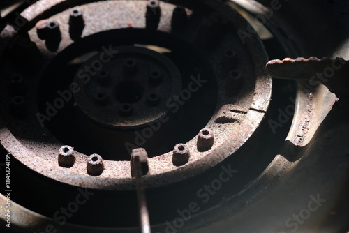 An old, rusty gas burner.