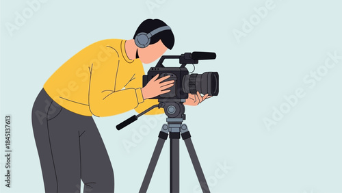 Skilled male videographer focused on capturing professional footage with a video camera on a tripod, demonstrating expertise in media production and content creation