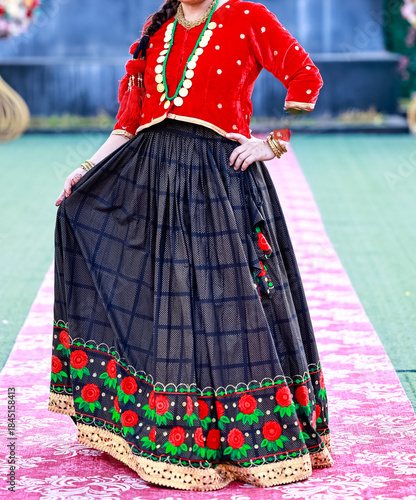 Portrait of an unidentified female artist dressed modern outfits while standing outside the garden. Fashion concept. Without face.