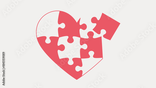 A heart shape formed by interlocking puzzle pieces in red and white on a light gray background symbolizing love and unity