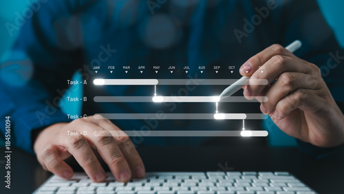Fotografía Milestone and progress planning concept for summary reports, showing manager or project engineer managing construction schedules with Gantt charts using software to update and track operational plans