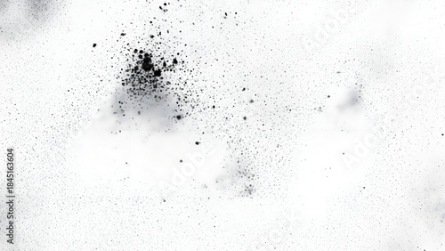 Abstract granular texture with dark speckles on a white background