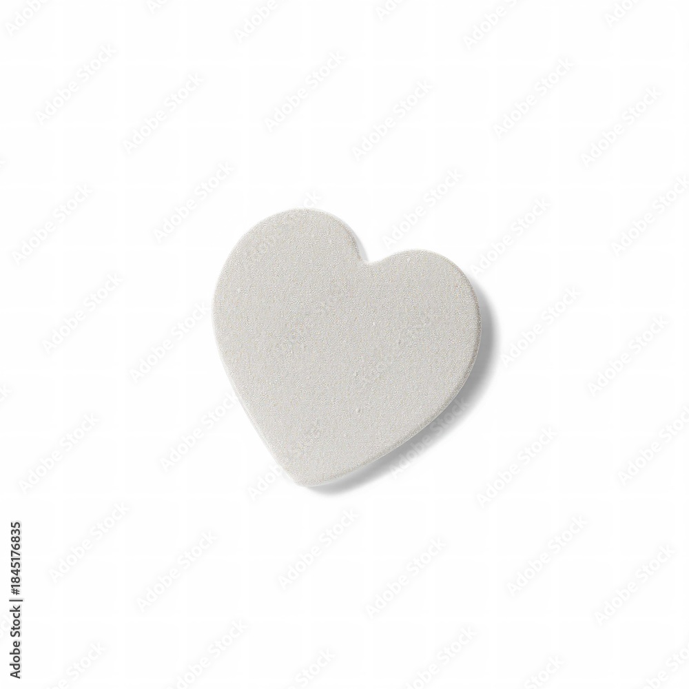 Fototapeta premium White heart-shaped object on plain background