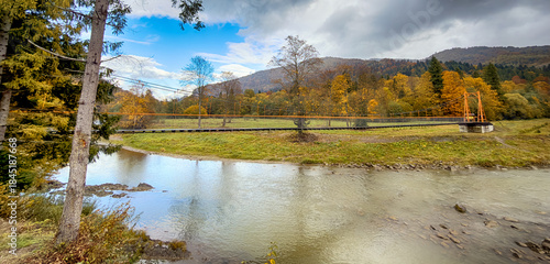 Sunny Autumn Carpathians with Puffy White Clouds