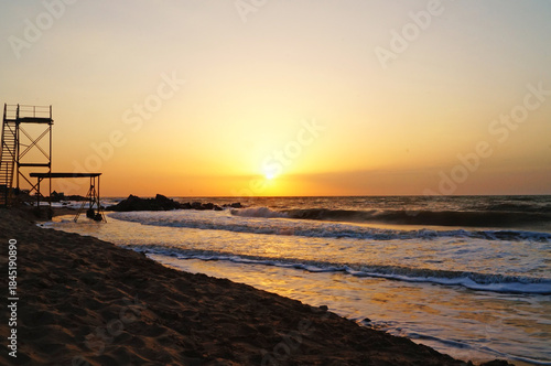 The coast of the Sea of ​​Azov in Ukraine at sunrise on a warm summer morning