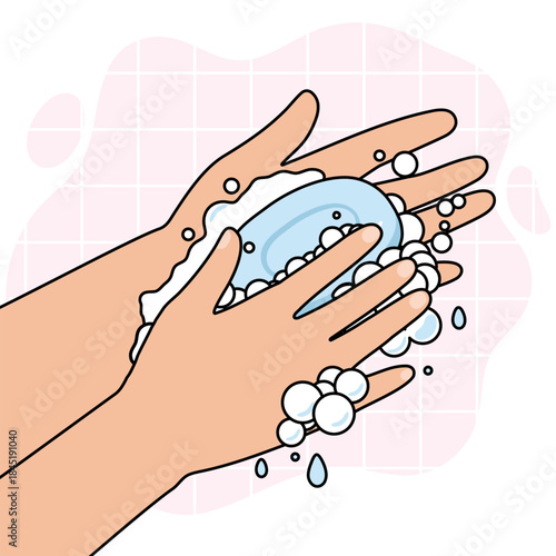 Hands of a person washing with a bar of soap, creating bubbles and foam. Concept of hygiene and cleanliness for health.