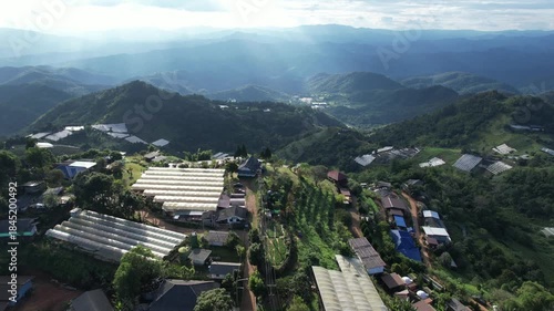 Aerial view from drone of the rural village and agriculture fields in the mountains