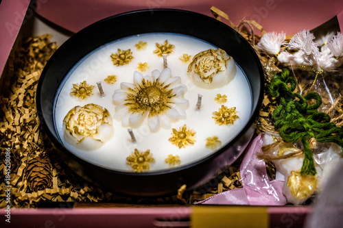 Luxury handmade candle gift box with white wax, golden floral decor, multiple wicks, elegant composition, festive aesthetic, premium home decor, holiday present concept, close-up still life