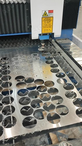 Laser cutting machine. Working process of laser cutting machine. Powerful laser beam for cutting. Cut stainless steel metal. Metal cutting machine. High precision, creating complex shapes CNC Vertical