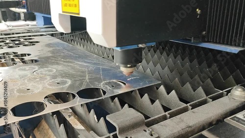 Laser cutting machine. Working process of laser cutting machine. Powerful laser beam for cutting. Cut stainless steel metal. Metal cutting machine. High precision, creating complex shapes CNC