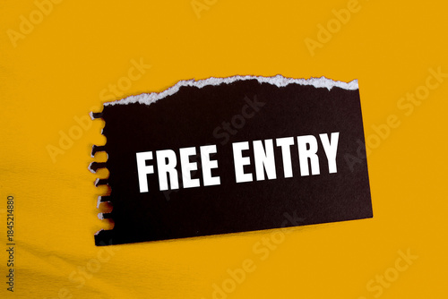 Free Entry message written on ripped torn paper background. Conceptual Free Entry symbol. Copy space.
