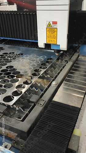 Laser cutting machine. Working process of laser cutting machine. Powerful laser beam for cutting. Cut stainless steel metal. Metal cutting machine. High precision, creating complex shapes CNC Vertical
