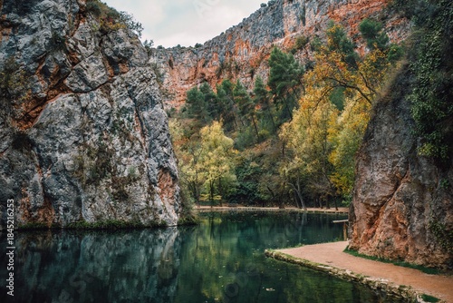 Tablou pe pânză Mirror Lake in Monasterio de Piedra Park, Calm Water Reflecting Cliffs and Autum