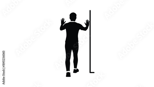 Silhouette of an athlete performing a wall push up exercise demonstrating strength training and physical fitness