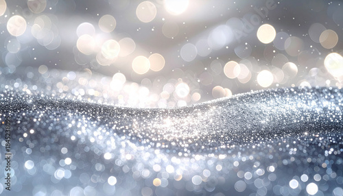 シルバーグレーのグリッター波が輝く高級感ある背景