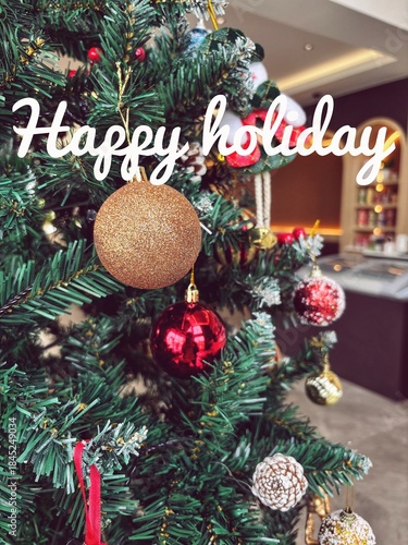 Happy Holidays Christmas Script Text Tree Background. festive message for the holiday season.