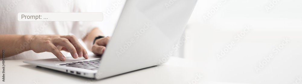 Fototapeta premium Prompt engineering skills concept. Businessman working on laptop with exploring artificial intelligence ai technology innovation and typing a prompt into search bar on keyboard computer