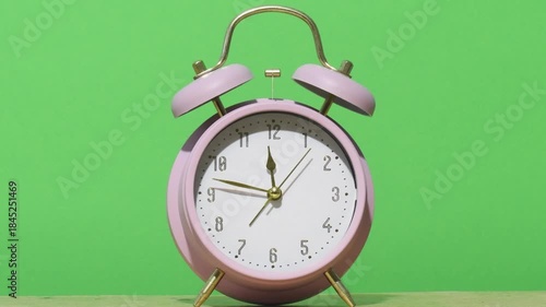 Clock shows time and ticks on a green background in a simple setup