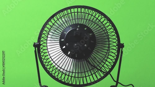 turning on fanf or better air flow in a room- on a green background