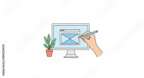 Web designer wireframing on computer monitor with plant  