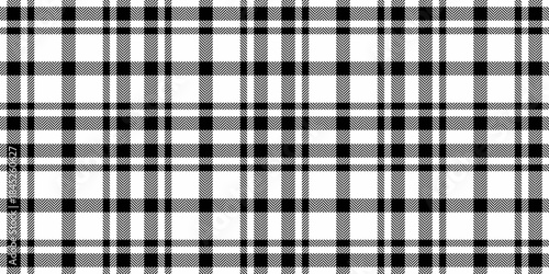 Warm plaid background check, xmas textile texture pattern. Flowing seamless vector fabric tartan in white and black colors.