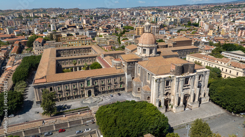 Bild auf Leinwand Aerial view of the church of San Nicolò l'Arena, a Roman Catholic church, and its adjacent and enormous Benedictine monastery in the city of Catania, Sicily, southern Italy
