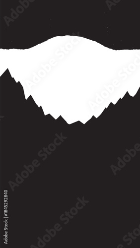 High contrast mountain silhouette against a dark sky, rugged peak and jagged ridge at dusk.