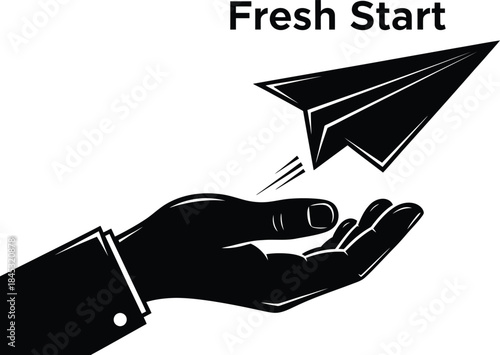 Hand releasing paper airplane representing new beginnings and freedom