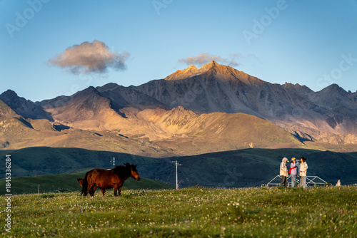 meadows and mountains at sunset, Tagong (Lhagang), Garzê Tibetan Autonomous Prefecture, Sichuan,  China