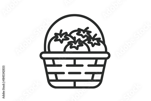 Full wicker basket overflowing with fresh ripe red garden tomatoes and assorted produce