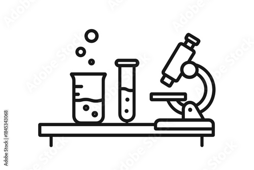 Scientific research tools including microscope, test tube, and beaker on laboratory bench