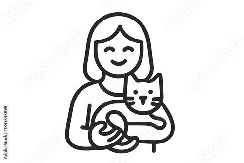 Smiling woman gently holding small cat in her arms