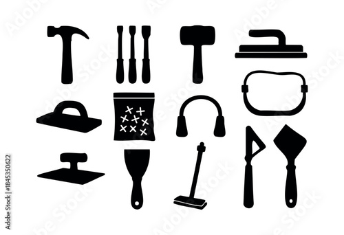 A collection of black silhouette icons depicting essential hand tools and safety equipment for construction, renovation, and DIY projects on a white background — stock vector.