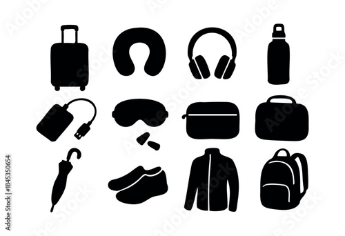 A collection of black silhouette icons representing essential items for travel and journey preparation on a white background — stock vector.