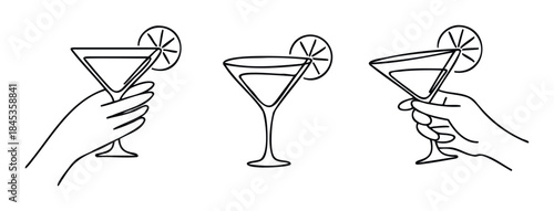 Hand holding martini glasses with lemon slice for celebration and party themes, perfect for beverage and lifestyle promotions