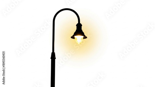 Black outdoor lamp post with a glowing light bulb