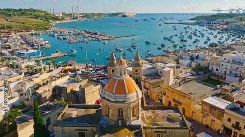 Fishing village Marsaxlokk and church. Drone view, Maltese island