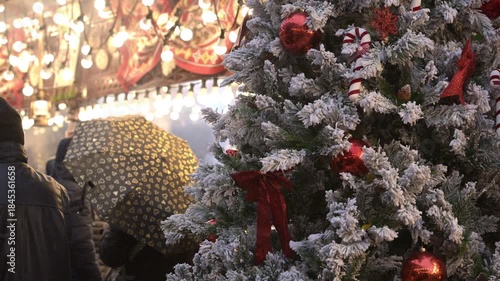 Frosted Christmas Tree and Crowd at Craiova Christmas Market